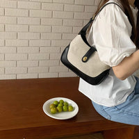 Petit sac à main en toile à fermoir tournant