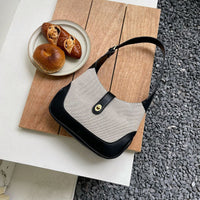Petit sac à main en toile à fermoir tournant