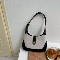 Petit sac à main en toile à fermoir tournant