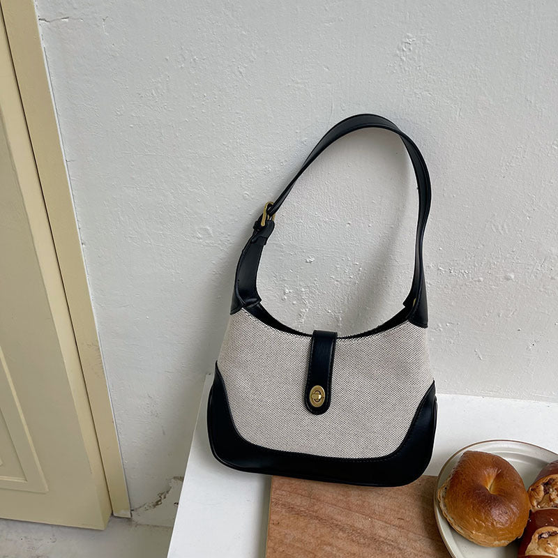 Petit sac à main en toile à fermoir tournant