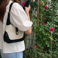 Petit sac à main en toile à fermoir tournant