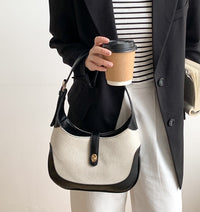 Petit sac à main en toile à fermoir tournant