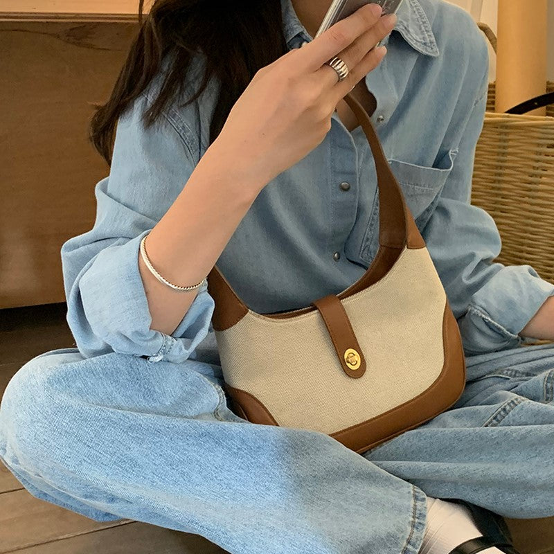 Petit sac à main en toile à fermoir tournant