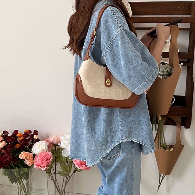 Petit sac à main en toile à fermoir tournant