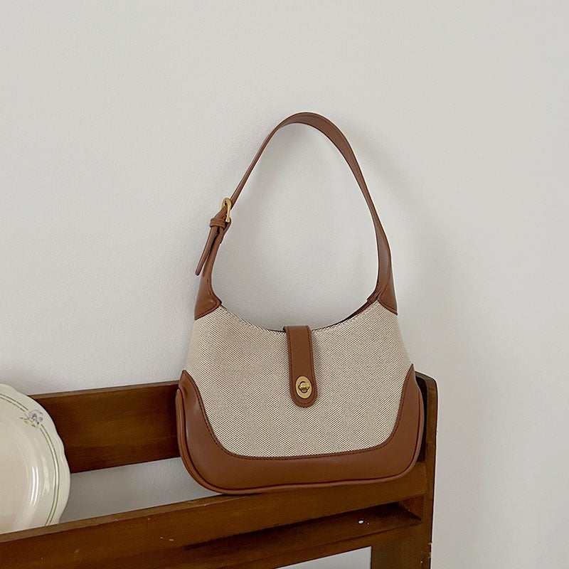 Petit sac à main en toile à fermoir tournant
