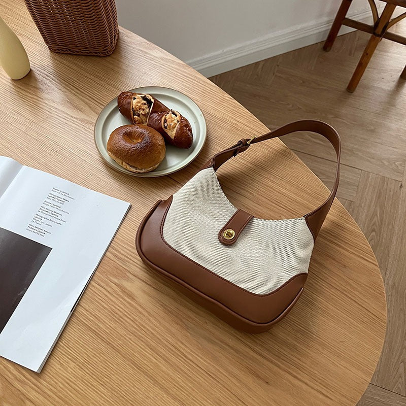 Petit sac à main en toile à fermoir tournant