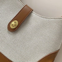Petit sac à main en toile à fermoir tournant