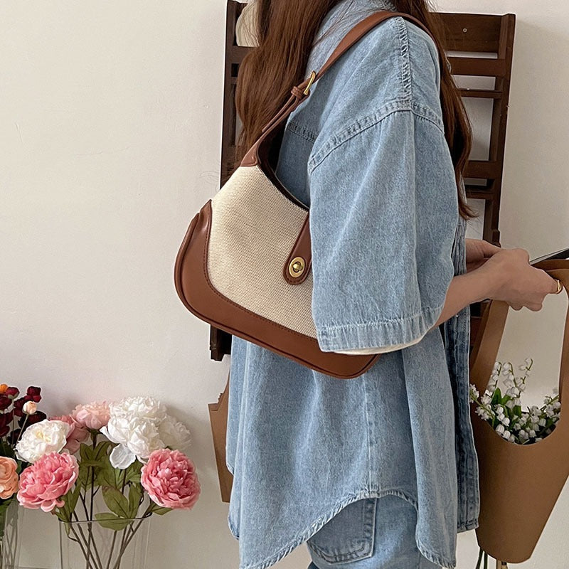 Petit sac à main en toile à fermoir tournant