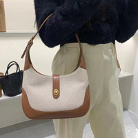Petit sac à main en toile à fermoir tournant