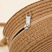 Petit sac rond en paille à bandoulière en corde