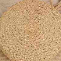 Petit sac rond en paille à bandoulière en corde