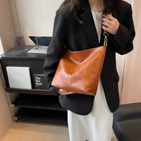 Sac bandoulière en simili cuir à sangle en tissu
