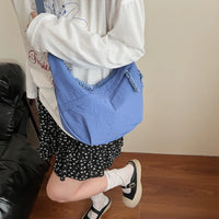 Sac bandoulière plat en nylon déperlant