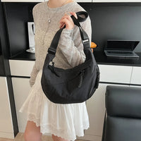 Sac bandoulière plat en nylon déperlant