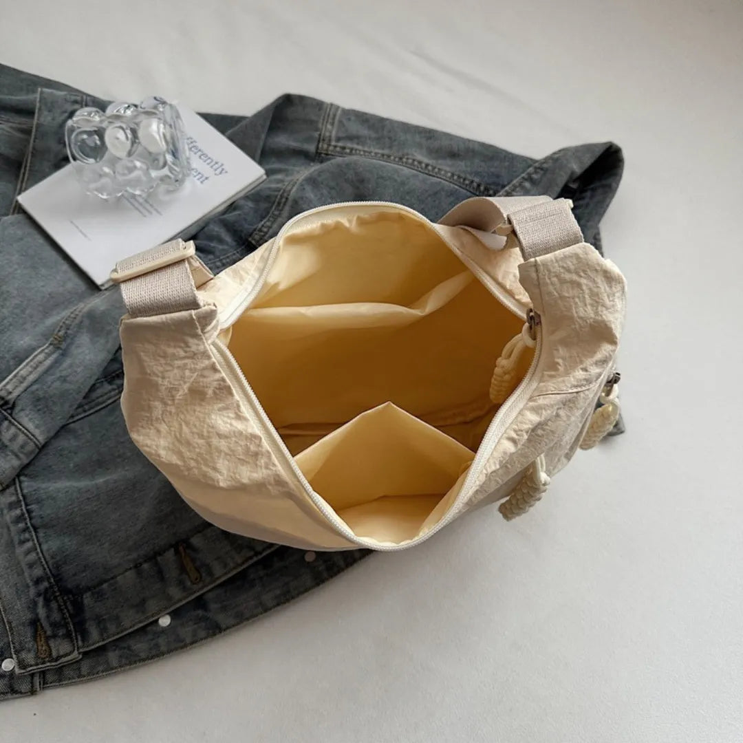 Sac bandoulière plat en nylon déperlant
