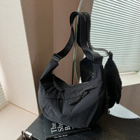 Sac bandoulière plat en nylon déperlant