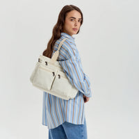Sac bandoulière en velours côtelé à poches zippées