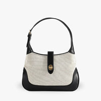 Petit sac à main en toile à fermoir tournant