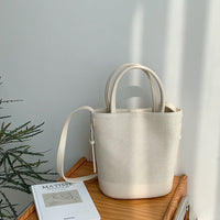 Sac seau en toile texturée à bandoulière réglable