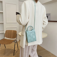 Mini sac à main tressé en simili cuir