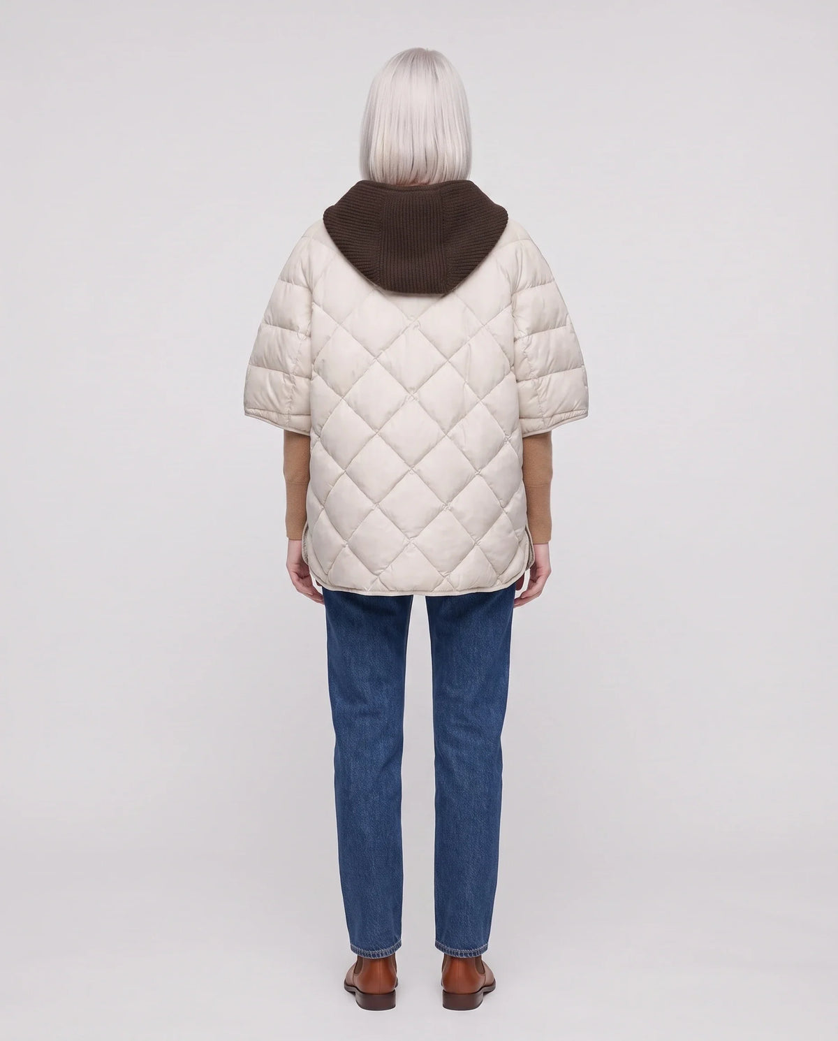 Cape matelassée à capuche tricot