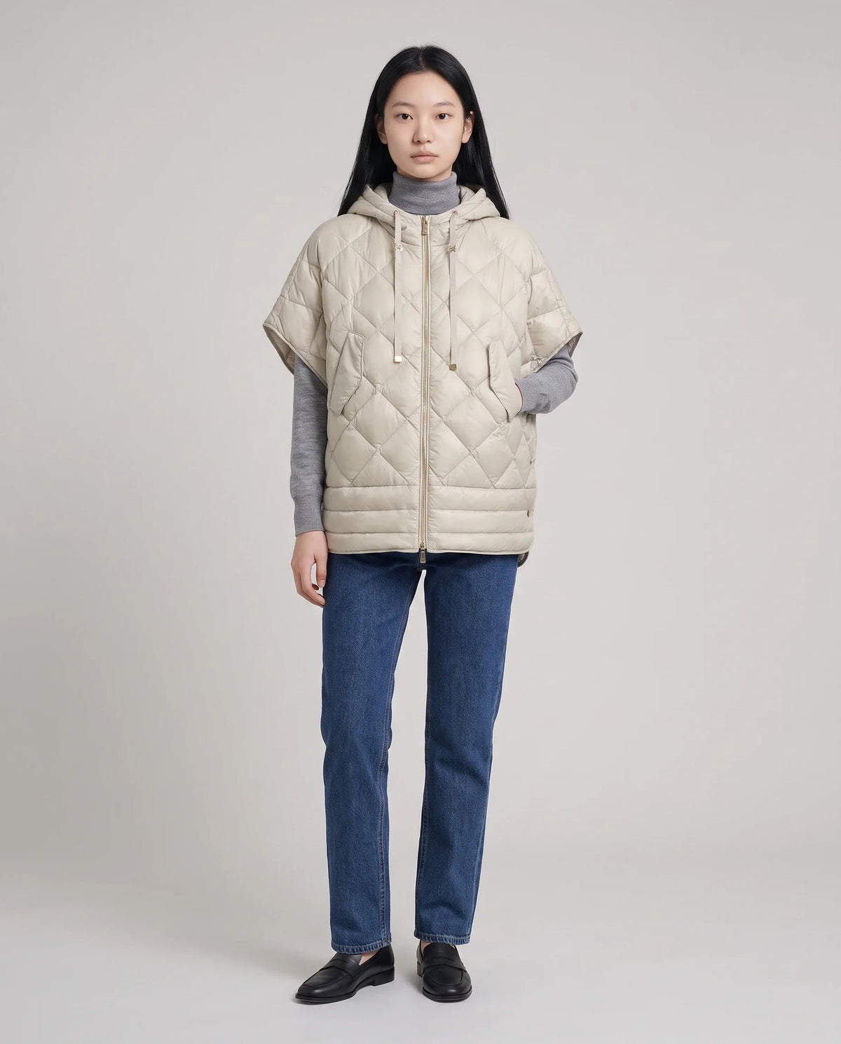 Gilet matelassé à capuche et pressions
