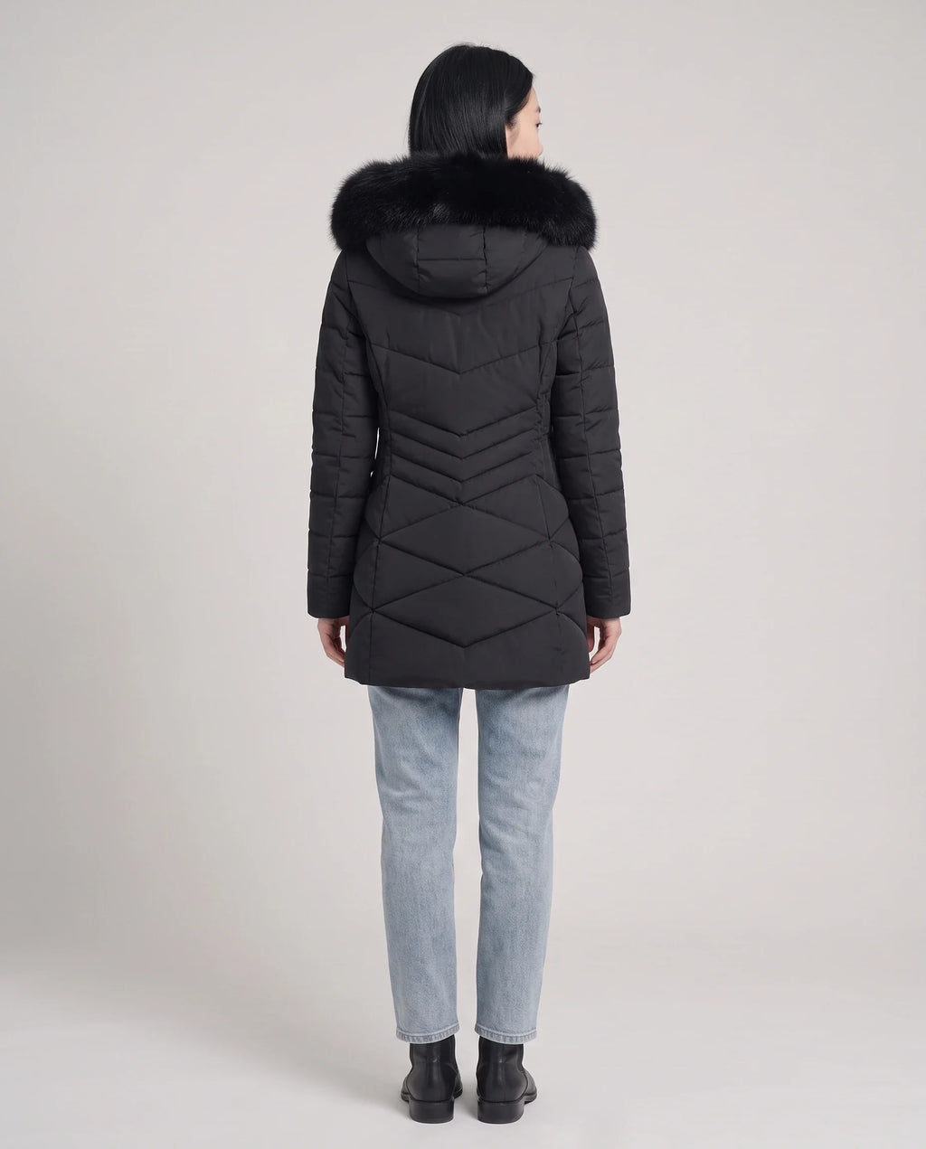 Parka mi-longue cintrée à capuche fourrure