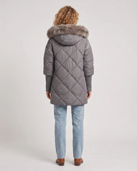 Parka mi-longue matelassée à manches tricot
