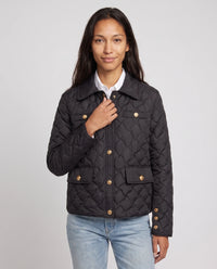 Veste matelassée à col chemise et pressions dorées