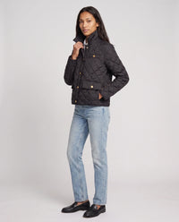 Veste matelassée à col chemise et pressions dorées